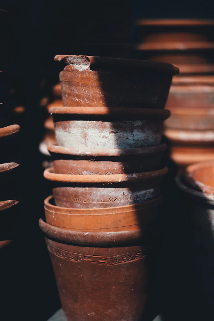 Stacked unglazed terracotta pots